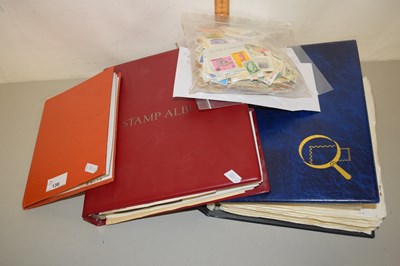 Lot 136 - Three stamp albums and a quantity of loose stamps