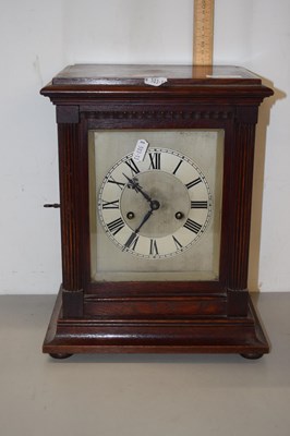 Lot 159 - A wooden cased mantel clock with brush...