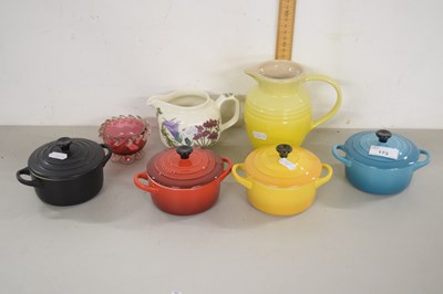 Lot 173 - Four miniature Le Crueset dishes and a jug and...