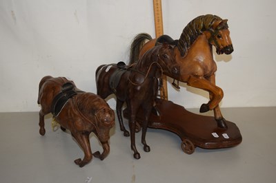 Lot 190 - Two leather models of a horse and a carved...