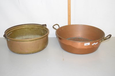 Lot 198 - A copper two handled pan and a brass jam pan