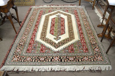 Lot 663 - White ground wool carpet floral gulled borders