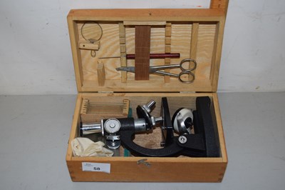 Lot 58 - A cased students microscope