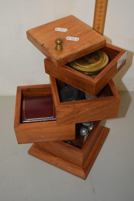 Lot 104 - An unusual rotating square storage box with...