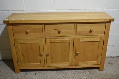 Lot 274 - A three cupboard, three drawer pine sideboard