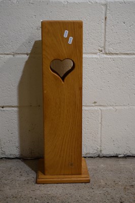 Lot 275 - A modern oak stick stand with heart decoration