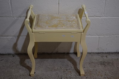 Lot 277 - A cream painted piano stool