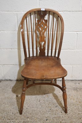 Lot 280 - An elm seated stick back dining chair with...