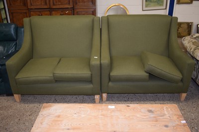 Lot 284 - A pair of green two seater sofas