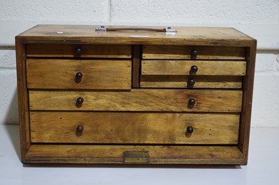 Lot 326 - A 20th Century plywood portable seven drawer...