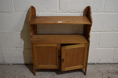 Lot 333 - A stained pine wall cupboard with two doors