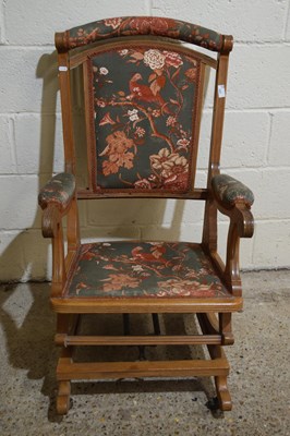 Lot 337 - A late Victorian American style rocking chair