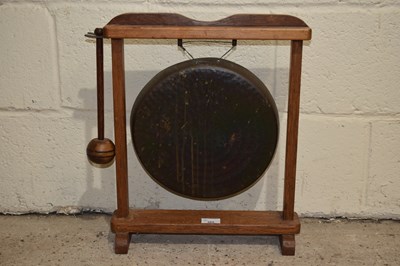 Lot 355 - A small brass dinner gong on hardwood frame