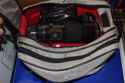 Lot 565 - A camera bag and contents to include a Hoya...