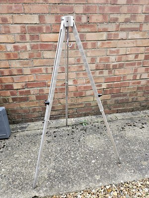 Lot 568 - An aluminium extending tripod with hanging hook