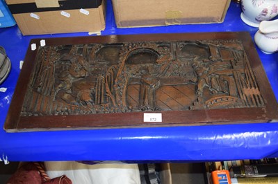 Lot 572 - A relief carved wooden panel