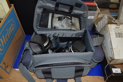 Lot 629 - A Pentax MZ7 camera with lenses and travel bag