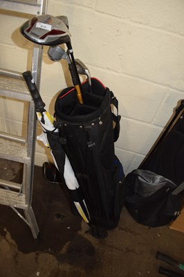 Lot 816 - Two golf caddies and assorted clubs