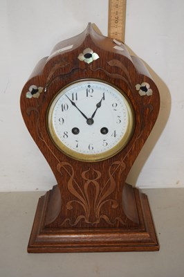 Lot 42 - A late 19th Century mantel clock set in an oak...