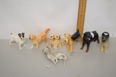 Lot 82 - A group of Beswick dogs and a further fawn model