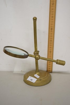 Lot 92 - A magnifying glass on adjustable brass stand