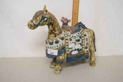 Lot 101 - A ceramic horse with attendant bird