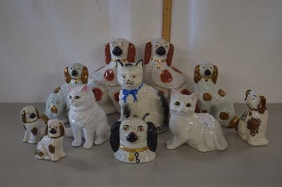 Lot 154 - A collection of Staffordshire model Spaniels...