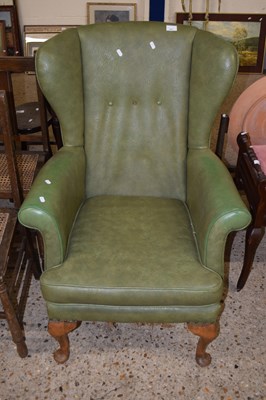 Lot 283 - Green leatherette upholstered wing chair