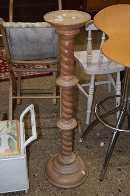 Lot 289 - A hardwood plant stand on barley twist column