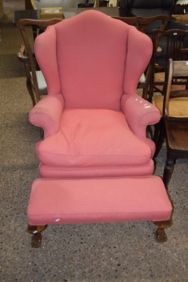 Lot 299 - A Georgian style wing back armchair on ball...