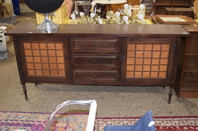 Lot 312 - A 20th Century dark wood sideboard with three...