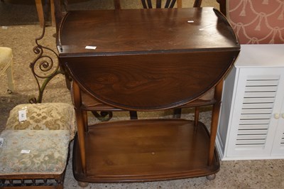 Lot 357 - A dark Ercol tea trolley with drop leaves