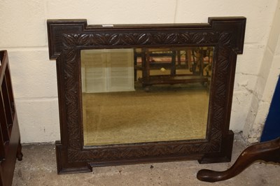 Lot 360 - A late 19th Century oak framed wall mirror,...