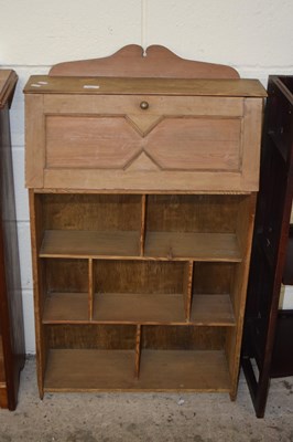 Lot 369 - A small pine students desk with shelving beneath