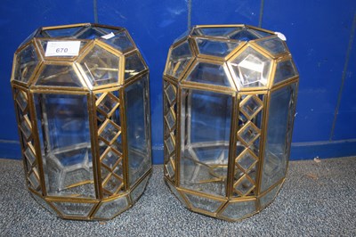 Lot 670 - A pair of brass framed and clear glass ceiling...