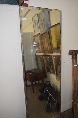 Lot 716 - A large rectangular bevelled wall mirror