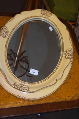 Lot 764 - A retro wall mirror in oval cream frame