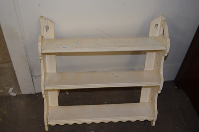 Lot 672 - A white painted wall shelf