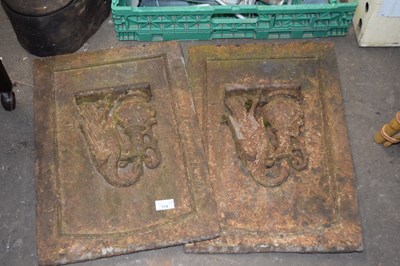 Lot 779 - A pair of cast iron panels decorated with bird...