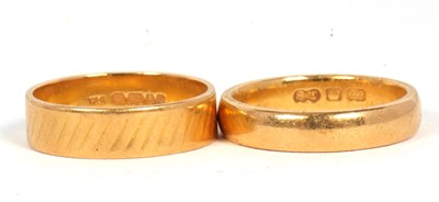 Lot 194 - Two 22ct wedding bands: to include a 5mm wide...