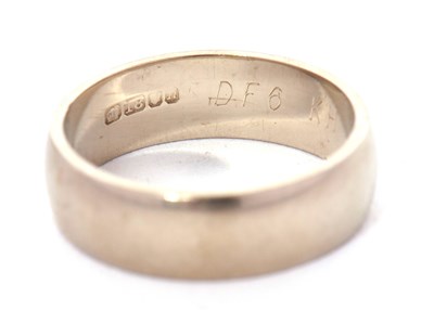 Lot 192 - An 18ct white gold wedding band, 5mm wide,...