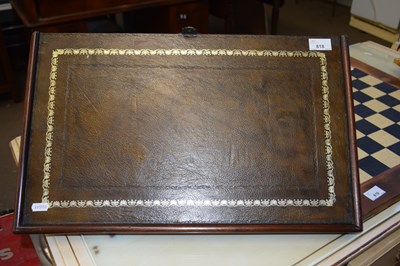 Lot 818 - A leather mounted hardwood wall bracket