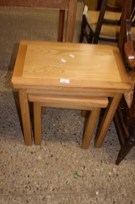 Lot 296 - Nest of two modern oak occasional tables