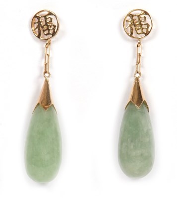 Lot 101 - A pair of jade earrings, the teardrop shape...