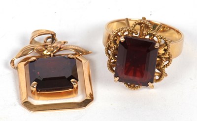 Lot 147 - A garnet ring and a garnet pendant: the ring...