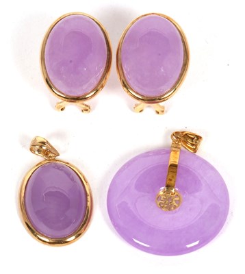 Lot 125 - Two lavender jade pendants and a pair of...