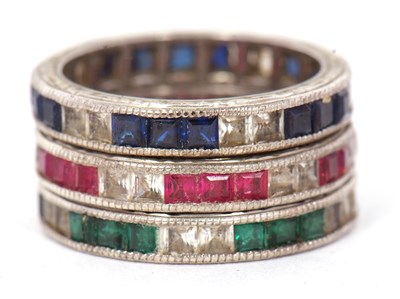 Lot 41 - Three gemset eternity rings: to include a...