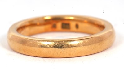 Lot 190 - A gold wedding band, 3.4mm wide, stamped 18,...