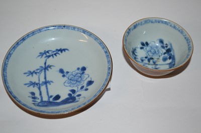 Lot 204 - A Nanking Cargo tea bowl and saucer with blue...