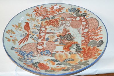 Lot 237 - A large Japanese porcelain charger, the centre...